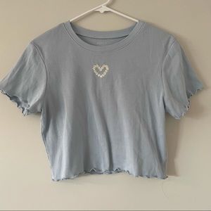 Light blue tight top, flower heart, size Xl, great condition worn once.